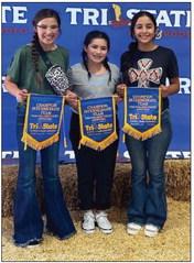The Collingsworth County 4-H team of Brylnn Kemp, left, Ava Peters and Hazel Estada garner first place in the Intermediate Appetizer category at the Tri-State Fair Food Challenge on Sept. 18 in Amarillo. “These kids did awesome, and we are so proud of them!” said Program Assistant Paige Owen.