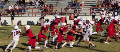 Eighth-grade Firecracker Callen Kane (8) rushes the ball to gain yards following his block Connor Bowen (11) and many other Firecrackers. Wellington shutout Clarendon 52-0 for its final game of the 2022 season Thursday, Nov. 3. The Red River Sun/Shauna Salinas