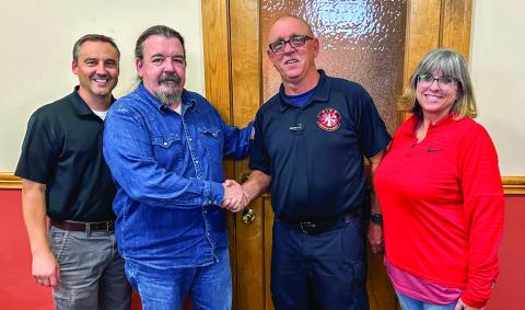 The City of Childress welcomes Childress Fire Department Chief Ralph Freeman Monday, Nov. 18. From left: Childress City Manager Kevin Hodges, City of Childress Mayor Cary Preston, Freeman, Mischi Freeman. The Red River Sun/Elizabeth Tanner