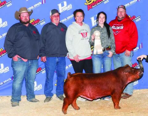 Wellington High School junior Kenady Skelton brings home a 10th place in the Duroc Barrow division of the recent San Antonio Stock Show &amp; Rodeo. From left: Colby Newbrough, Dave Newbrough, Carrie Skelton, Kenady Skelton, Chad Skelton. Photo Courtesy of Collingsworth County Livestock Association