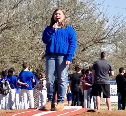Monson Music Studio student Kinzlee Willis performs the National Anthem during the 3rd Annual Childress Little League Opening Day Fest, which included a vendor market, followed by the first games of the season, Saturday, March 26 at Rock Field. Monson Music Studio