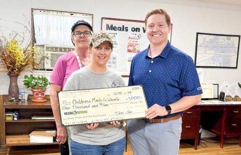 First United Bank Vice President and Banking Center Manager Alabama Bohannon, a Ray M. and Barbara Bain Award recipient, makes a $1,000 donation to the charity of his choice, Childress Meals on Wheels. Courtesy Photo