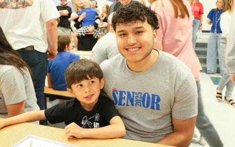 Kindergarteners, seniors team up for Kindergarten Signing Day