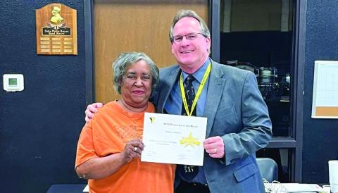 Memphis High School Instructional Assistant Sharon Hearn receives March Employee of the Month recognition during a recent Memphis Independent School District (ISD) Board of Trustees meeting. Hearn is congratulated by Memphis ISD Superintendent William Alexander. The Memphis ISD Employee of the Month program is sponsored by First Bank and Trust. Memphis ISD