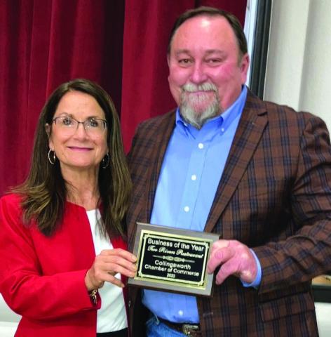 Two Rivers Family Restaurant owner Clint Thomas, right, receives the Collingsworth County Chamber of Commerce Business of the Year from Karen Caldwell. Photos by Neal Odom