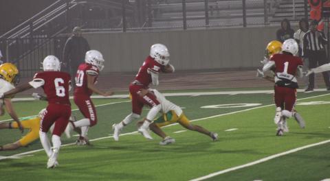 Wellington junior varsity Skyrocket Alex Orozco (5) gains yardage in the game versus New Deal in Floydada last Thursday, Nov. 7. Wellington won the game 22-18 as officials called the game in the third quarter due to heavy rain. Other Rocket blockers included Carson Kane (1), Jr Vega (50) and Troy Molina (6). The Red River Sun/Shauna Salinas