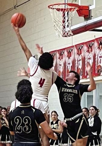 Wellington Rocket Jordan Nation (4) jumps to put points on the scoreboard against Wheeler Tuesday night, Jan. 31 with Braylon Tarver (12) ready for the rebound. The Red River Sun/Shauna Salinas