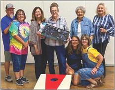 Sharon Starkey garners highpoint individual honors, winning a light-up cornhole game, at the recent September Wellington Senior Citizens Center social. Cornhole winners gather for a fun shot at the end of the evening. Front row, from left: Karen Caldwell, Dawn Dockter. Back row, from left: David and Kim Lambert, Margret Wood, Starkey, Katherine Reeves, Vada Wood. Not pictured: Billy Colson, Les and Lisa Freeland, Genevieve Patterson, Linda Powell, Marie White. Courtesy Photos