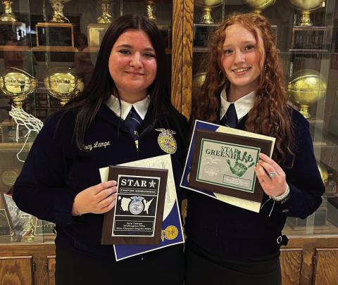 Sophomore Jacy Lampe, left, and freshman Bailey Page accept some of the top honors at the Wellington Future Farmers of America (FFA) Awards Banquet, held Wednesday, May 7 in the Wellington High School Commons. Among other awards, Lampe received the Wellington FFA Star Chapter Degree 2024, while Page accepted the Star Greenhand accolade. Courtesy Photo