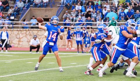 Childress quarterback Koen Galligan looks to make a connection with wide receiver Benton Sims during the Bobcats’ 21-14 win over Breckenridge Friday, Sept. 5 at Fair Park Stadium in Childress. Childress High School Yearbook