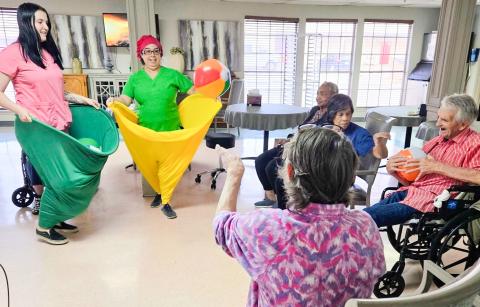 Situated in the dining room and attired in “Granny Pants,” Wellington Care Center staff encourage residents to toss balls into oversized, wearable pants. Fun and laughter filled the room, and everyone had a great time working together, staying active and sharing plenty of smiles. Wellington Care Center