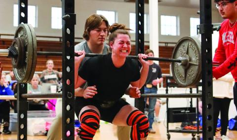 Childress’ Kennedy Smithwick squats 240 pounds, putting towards her 665-pound total, which won weight class 181. Photo by Childress High School Yearbook Staff