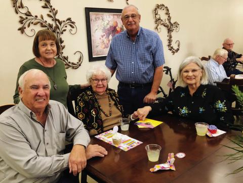 In the dining room of Wellington’s Parkview Manor Assisted Living, Helen Parker, center, celebrates her 103rd birthday on Monday, Nov. 18. From left, son and daughterin- law Gary and LaDonna Oldham, of Samnorwood; the honoree; nephew Clinton Oldham, of Winnie; and niece Rosa Carter, of Wellington. The Red River Sun/Bev Odom