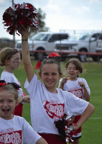 Skyrocket mini cheer campers shout football victory vibes