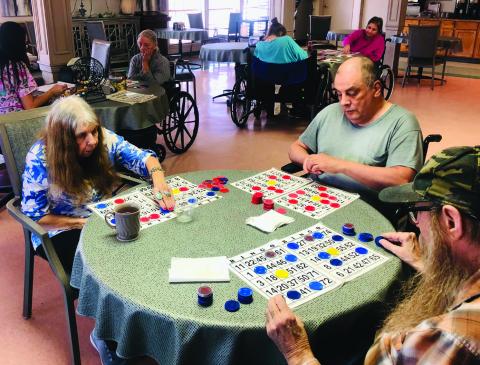Wellington Care Center Activity Director Thalia Herrera calls a competitive game of bingo during a recent afternoon in the dining room of the facility. Regardless of the activities offered, certain residents never pass up an opportunity to play bingo. The Red River Sun/Bev Odom