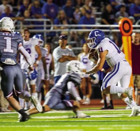 Childress quarterback Scout Smith (11) dodges opponents as he runs the ball during the Bobcats’ 49-22 win over Bowie Friday night, Sept. 23 at Jackrabbit Stadium. The Red River Sun/Nicole Dill