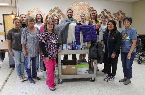 Childress High School (CHS) Family, Career and Community Leaders of America (FCCLA) members, including Emma Britten, Adlee Lambert and Jillian Pierce, pick up coat drive donations at Childress Regional Medical Center Wednesday, Nov. 8. The donations, ranging from coats to personal hygiene items, were contributed to Childress County Christmas Sharing’s Winter Coat Giveaway. The Red River Sun/Elizabeth Tanner