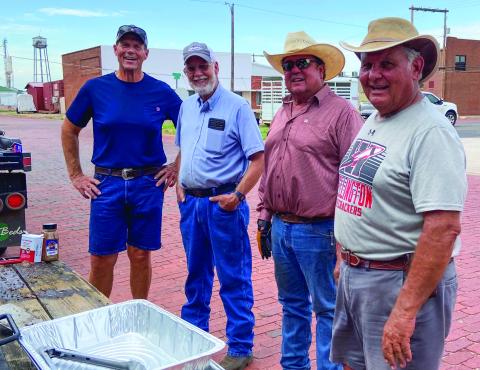 Paul Dockter, left, Oran Sain, Don Allred and Keith Martin share their skills, grilling hamburgers and hotdogs for Wellington Senior Citizens Center’s monthly social at 6 p.m. Thursday, July 13. Courtesy Photos