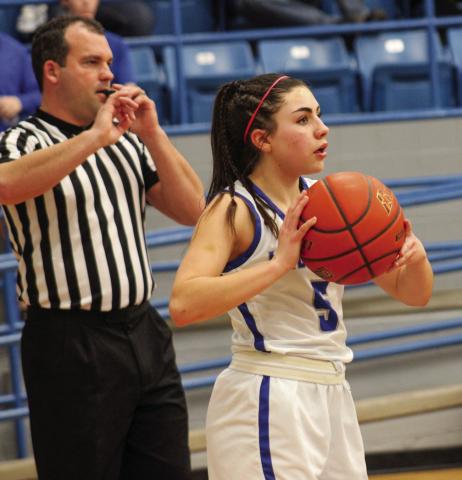 Lady Cat Aspen Lomax passes the ball during a 62-26 win over Slaton Friday, Jan. 27 in Childress. The Red River Sun/Elizabeth Tanner