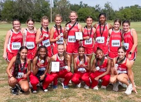 The Wellington Lady Rocket and Lady Firecracker cross country teams earn championship finishes at the Second Annual Hollis Cross Country Meet on Saturday, Sept. 6 in Hollis, Okla. Front row, from left: Lady Rockets Sabrina Segovia, Angela Lewis, Taytum Kane, Kobee Lewis, Aleah Lewis, Anna Henard. Back row, from left: Lady Firecrackers Abbygale Torrez, Jessalee Peters, Halle Hedrick, Ava Kate Inman, Kaesyn Kane, Claire Kane, Priscilla Marentes, Evie Henard, Quinn Roberson. Wellington High School
