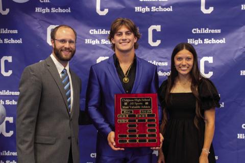 Childress Athletic Director Bo Helm, left, awards Best All-Around Bobcat Athlete Scout Smith, center, and Best All-Around Lady Cat Athlete Clarissa Gamboa, left, at the 2023-2024 All-Sports Banquet Monday, May 20. The Red River Sun/Elizabeth Tanner