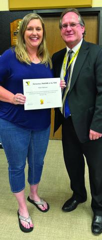 District Dyslexia Coordinator Nikki Robison is named the Memphis Independent School District (ISD) Elementary Teacher of the Year, as well as Memphis ISD Teacher of the Month. Robison is awarded by Memphis ISD Superintendent William Alexander. Photos Courtesy of Memphis ISD
