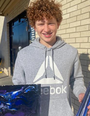 Junior high art students create acrylic pour canvases, vases