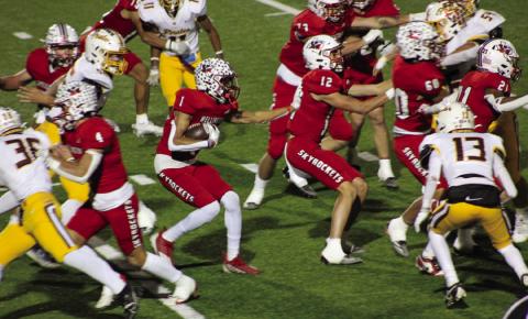 Wellington’s Brenden Garcia (1) runs the ball behind his blocks, Callen Kane (12), RJ Granadoz (60), Noah Cantu (4), Travon Lewis (21), Dalton Holland (73) and Anthony Ortiz (15), as the Skyrockets closed the season in a 24-13 final against the Collinsville Pirates Friday, Nov. 22 in Iowa Park. The Red River Sun/Shauna Salinas