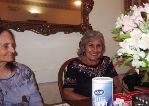 Karen Cornett, right, beams after calling “Bingo!” upon achieving a blackout bingo card at the weekly playing session at Cottage Village Assisted Living Facility in Childress. At left is a regular player, Chick Steed. This week’s caller was Celia Parker, stand-in for Anne Fromm, usual caller of the Tuesday afternoon games. Friends and relatives of Cottage Village residents are usually on hand, joining in on the fun. Photo by Grace Holman
