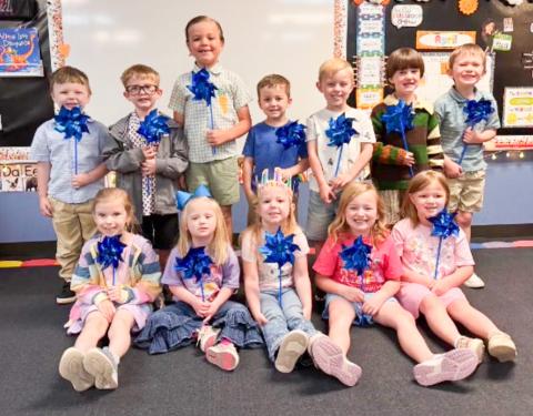 Provided by the Collingsworth County Child Welfare Board, supporting Child Protective Services (CPS), each Wellington Elementary School student received a blue pinwheel, displayed by pre-kindergarten classmates. Wellington Elementary School