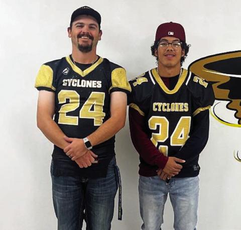 Senior Dominik Castillo swaps with Christian Brooks.