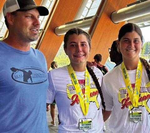 Childress High School sophomore Taylor Wiseman, center, competes in the National Scholastic Athletics Foundation (NSAF) 2023 Nike Outdoor Nationals, snagging a fifthplace finish in discus with a 147-10 throw. Courtesy Photo