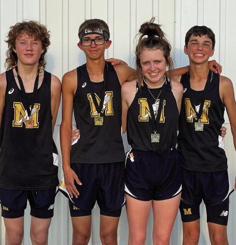 Four Cyclone cross country runners, including Ethan McAllister, left, Ryder Robison, Braylee Brooks and Kyler Robison, medal at the recent 18th Annual Rattlesnake Run, held Tuesday, Sept. 13 in Guymon, Okla. K. Robison finished 18th in the junior high division, while McAllister finished 15th in the junior varsity division. In the varsity division, R. Robison finished third, while Brooks finished 11th. Photo Courtesy of Memphis ISD