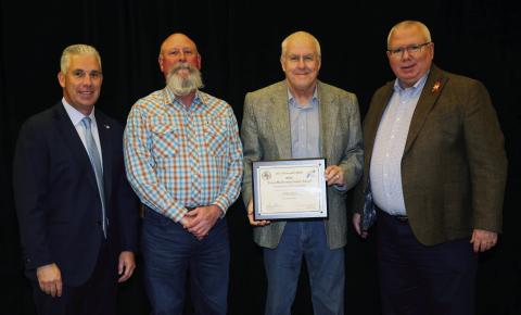 The Childress District of the Texas Department of Transportation (TxDOT) accepts the Texas Bluebonnet Safety Award, recognizing zero incidents in 2024. From left: The Associated General Contractors of Texas President Jeff Gibson, Childress District Safety Officer Jeremy Beck, Childress District Engineer Darwin Lankford, TxDOT Deputy Executive Director for Program Delivery Brian Barth. Texas Department of Transportaition