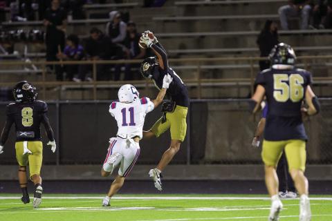 Childress’ Elliot Theparrukkul attempts to stop an interception by Canadian defensive back C.J. Jimenez during a district championship matchup Friday, Nov. 7 at Wildcat Stadium in Canadian. Press Pass Sports/Carter Pirtle