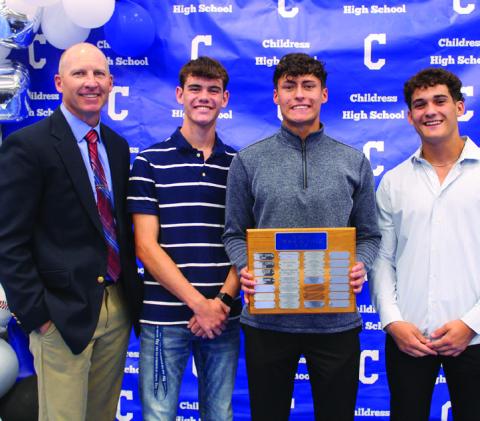 Boys’ head track coach Lee Brandon, left, awards Bobcat Track Co-Most Valuable Players (MVPs) Gavin Navarette, second from right, and Conner Keys, second from left, and Bobcat Field MVP Colton Teichelman, right.