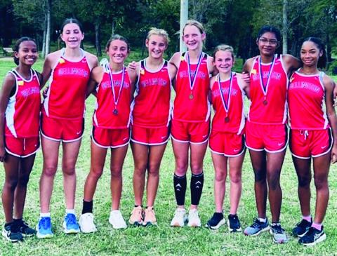 Courtesy Photo Under the direction of Coach Karen Fisher, the Wellington Lady Firecracker cross country team captured the district championship Wednesday, Oct. 9 in Wheeler. Kaesyn Kane led the team as the first-place medalist; followed by Claire Kane, second-place; Priscilla Marentes, eighth-place; and Halle Hedrick, ninthplace. From left: Kobee Lewis, Anna Dwyer, C. Kane, Ava Kate Inman, K. Kane, Hedrick, Marentes, Jaylah Menefield.