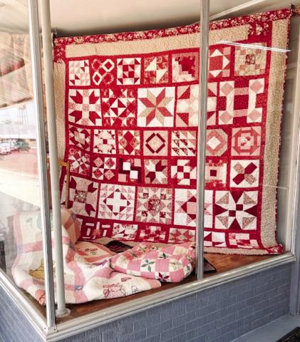 Wellington Methodist Women’s 2024 quilt creation, “Women of the Bible,” graces the display window of the Collingsworth County Museum during the Wild &amp; Free on 83 events in August. Members sold raffle tickets during the affair. Tickets are $5 each or five for $20. For tickets, see Karen Caldwell at the museum or Bev Odom at “The Red River Sun” newspaper office. Tickets will also be sold during the annual bazaar fundraiser event this Saturday, Nov. 2. Courtesy Photo