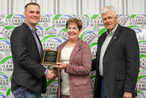 Jim and Carol Freeman receive the Lifetime Achievement Award, presented by Childress Chamber of Commerce Board of Directors member Travis Brooks, during the 2025 Childress Chamber of Commerce Banquet Awards Ceremony Monday, Feb. 16 at the Mashburn Event Center. The Red River Sun/Elizabeth Tanner