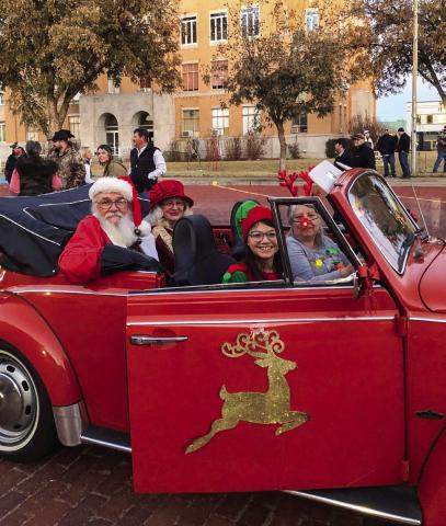 For the December 2023 Lighting of the Collingsworth County Courthouse Square, Helena Stanley chauffeurs Santa and Mrs. Claus, accompanied by their elf, Brianna Torrez. The famous courthouse star lit up around dusk with the festive Christmas light display. The Red River Sun/Bev Odom