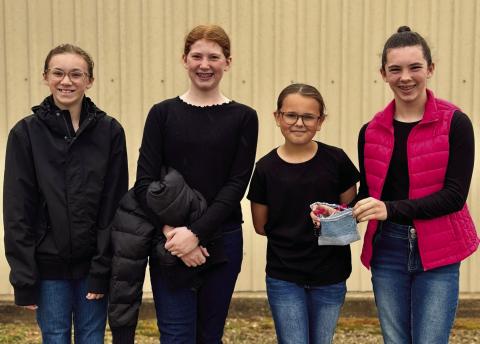 Childress County 4-Hers compete at the Rolling Plains District 3 Fashion Show Saturday, April 5 in Archer City. Taking a second-place team finish in Duds to Dazzle, Liesel Schaefer placed first in Junior Storyboard, Miranda Henry placed first in Intermediate Storyboard and third in Fashion Under $25 and Cambri Willis placed second in Dressy to Semi-Formal. From left: Henry, Schaefer, Willis, Libby Sanford. Childress County 4-H