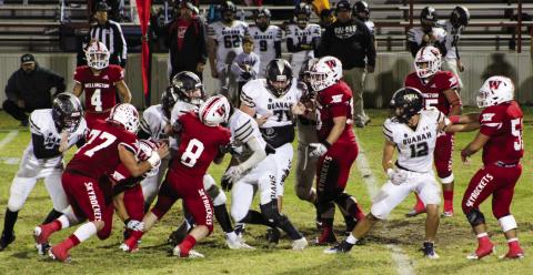 Skyrocket Caleb Strickland (8) rushes in for a tackle against the Quanah Indians last Friday, Oct. 28 with assistance from Gumaro Rincon (4), Rey Ramirez (77), Blake Strickland (50), Ethan Nevarez (44), Fabian Pina (65) and Ramon Rodriguez (51). Shauna Salinas/The Red River Sun