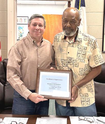 Mayor Joe Davis presents an appreciation award to Alderman Woodrow Richardson for his 24 years of service to the citizens of Memphis during Monday’s council meeting.