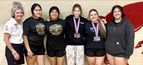 Qualifying Memphis powerlifters compete at regional invitational Friday, March 6 in Odessa, where Lizzie Valle punched her ticket to the upcoming Texas High School Women’s Powerlifting Association’s State Championships. From left: Coach Michelle Branigan, Nicole Villanueva, Joslyn Cobos, Selena Friesen, Valle, Katrina Torres. Memphis ISD