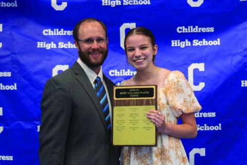 Kara Palomo, right, accepts Lady Cat Tennis Most Valuable Player (MVP) from Athletic Director Bo Helm. Not pictured is Bobcat Tennis MVP Ben Souder.