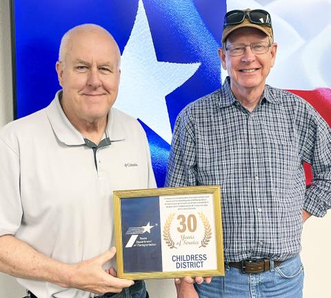 Texas Department of Transportation (TxDOT) Childress District Operations Jimmy Bridges, right, accepts a 30-year service award from TxDOT Childress District Engineer Darwin Lankford. For additional photos, see 8A. Texas Department of Transportation
