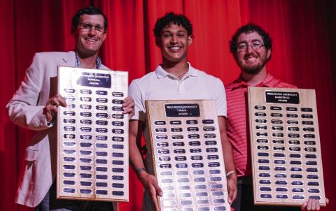 Wellington High School (WHS) senior Brenden Garcia accepts the Football Outstanding Receiver Award, Boys’ Basketball Most Valuable Player (MVP) Award and Boys’ Track Sprinter Award, presented by Athletic Director Greg Proffitt and Coach Quenton Patterson, at WHS’ Academic and All-Sports Banquet at 5:30 p.m. Monday, May 12 at the WHS auditorium. The Red River Sun/Shauna Salinas