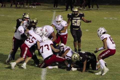 Skyrockets Dalton Holland (73), Jackson Jones (55), Nick Nevarez (79), Ramon Rodriguez (51), Caleb Strickland (50), Ethan Nevarez (44) and Anthony Ortiz (15) take down a Cyclone Friday, Oct. 13 in Memphis. The Red River Sun/Shauna Salinas
