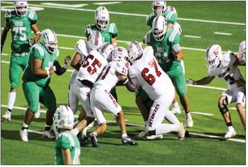Wellington’s Jackson Jones (55), Kingston Molina (51), Jovani Munn (67), Yobani Moreno (65), Caleb Strickland (8) and Gunner Guy (3) cloud the Shamrock Irish offense during the Skyrockets’ 56-14 sweep Friday, Oct. 25 at El Paso Field in Shamrock. The Red River Sun/Shauna Salinas