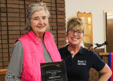 Longtime Memphis resident Jackie Owens is awarded the Lifetime Achievement Award, presented by Memphis Chamber of Commerce President Leslie Ivy, during the 105th Annual Memphis Chamber of Commerce Banquet Friday, March 13 at the Memphis Community Center. The Red River Sun/Elizabeth Tanner